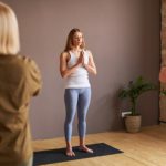 Fitness instructor with yoga class