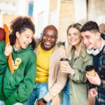 International life style concept with friends walking together at old town center