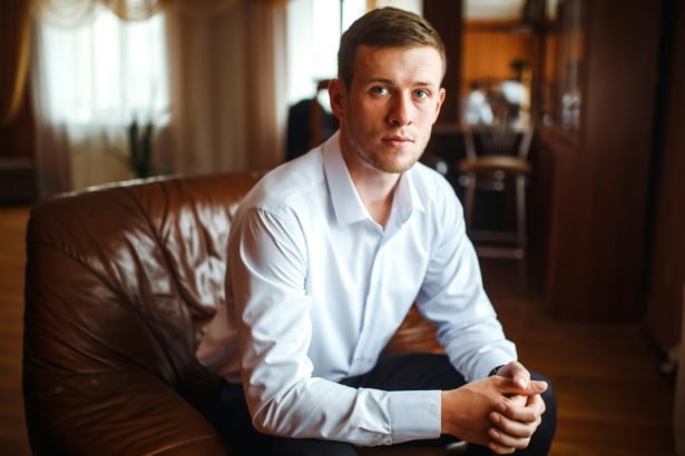 Luxury groom in suit. Businessman. Morning Groom Fees. beginning of the wedding day. Men's fashion.