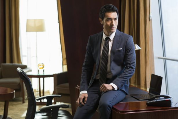 Portrait of successful businessman in study