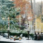 the windowsill is full of a variety of things and candles