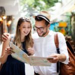 Tourist couple traveling. Travel. Walking on street. Portrait of beautiful young people