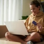 Woman doing shopping online at home